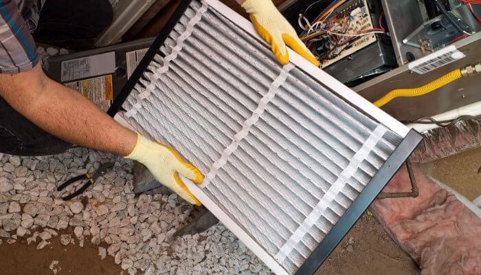 technician changing filter